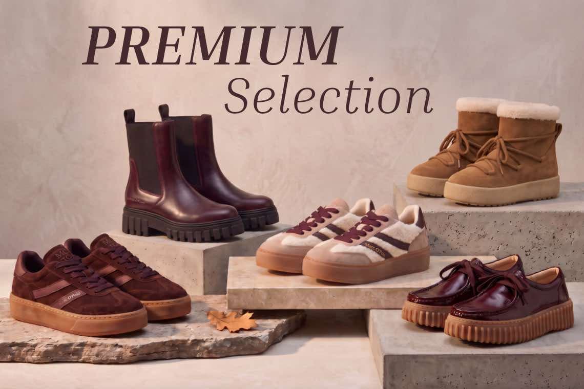Premium Selection – verschiedene Damen-Schuhe in Braun- und Beigetönen auf Podesten in herbstlicher Deko