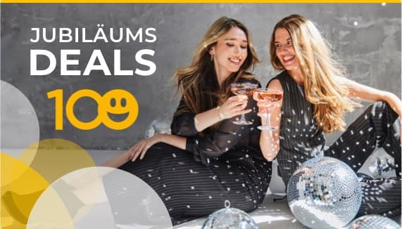 Jubiläums Deals 100 – Zwei Frauen in schwarzen Kleidern feiern mit Champagnergläsern, umgeben von Discokugeln