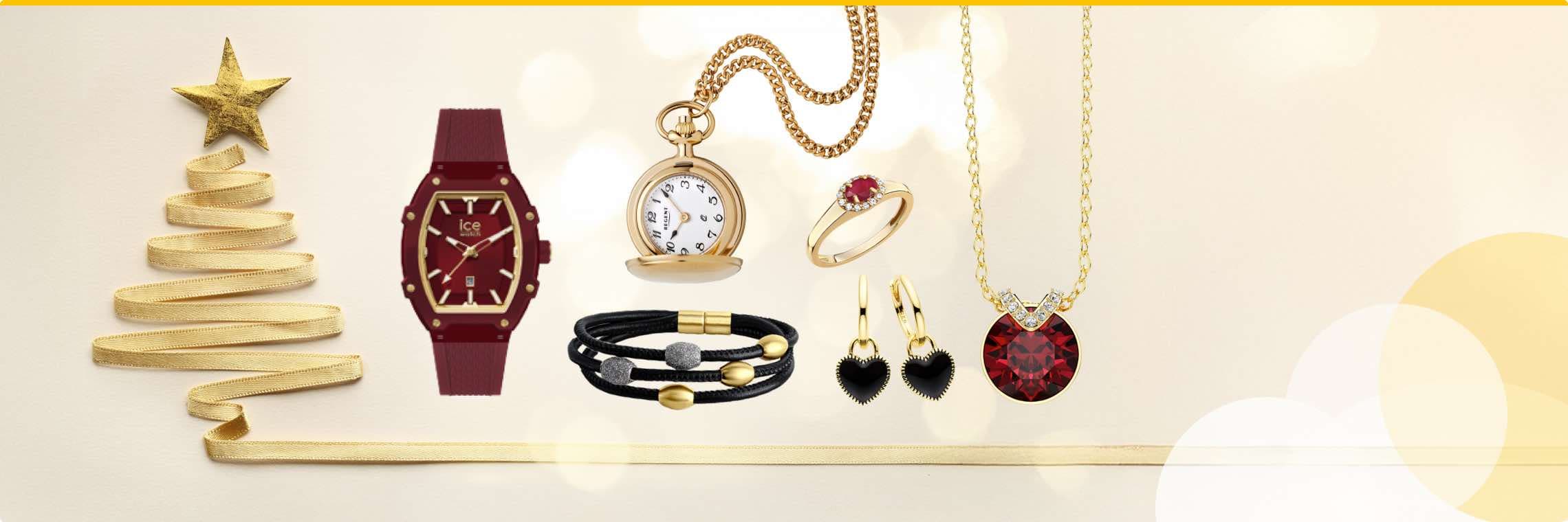 Weihnachtsbaum aus goldenem Band neben roten und goldenen Schmuckstücken, darunter Uhren, Armbänder, Ringe und Anhänger.