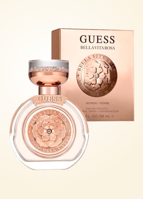 GUESS Bella Vita Rosa – runder Damenparfumflakon mit passender Schachtel im Hintergrund