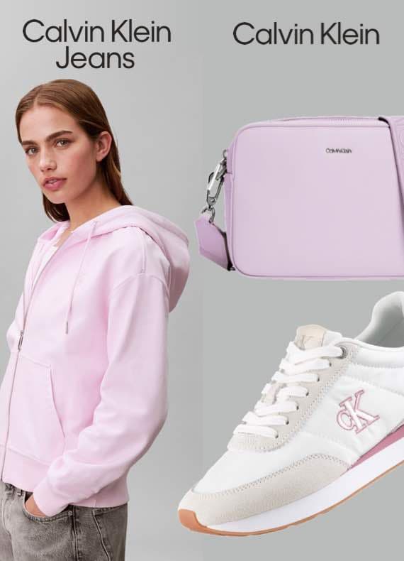 Calvin Klein Jeans – Person in rosa Hoodie, Calvin Klein Tasche und Sneaker