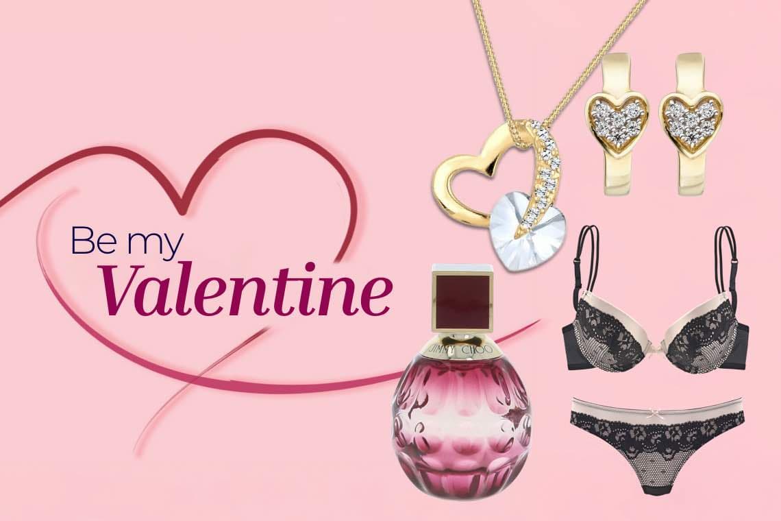 Be my Valentine – Schmuck, Parfümflakon, und schwarze Spitzenunterwäsche auf rosa Hintergrund