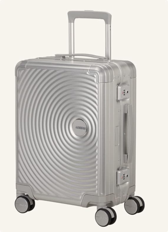 Silberner Rollkoffer mit kreisförmigem Muster, vier Rollen und Teleskopgriff, seitlicher Tragegriff und eingebautes Schloss