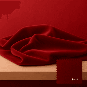 Rundes graues Sofa mit Streifen und drei passenden Kissen