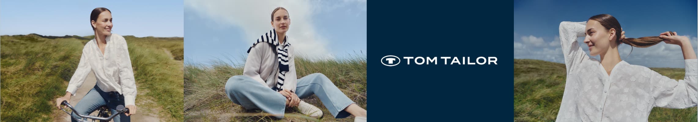 Tom Tailor – Frau in weißer Bluse und Jeans auf Fahrrad, sitzend im Gras, und beim Haare binden vor blauem Himmel.