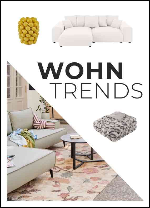 WOHN TRENDS – Wohnzimmer mit gemütlicher Einrichtung, Sofas, Decke, Kommode und Deko-Objekt.