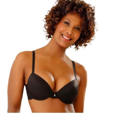 Frau mit lockigem Haar trägt schwarzen BH, Gesicht unscharf