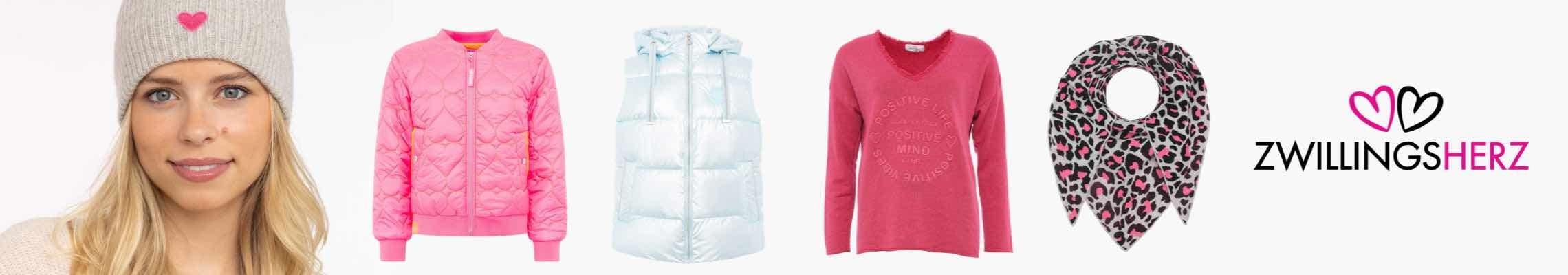 ZWILLINGSHERZ – Frau mit Mütze, pinke Jacke, weiße Weste, pinker Pullover, gemusterter Schal